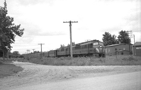 PRR Centipede diesels pull passenger train at Carp Lake, MI